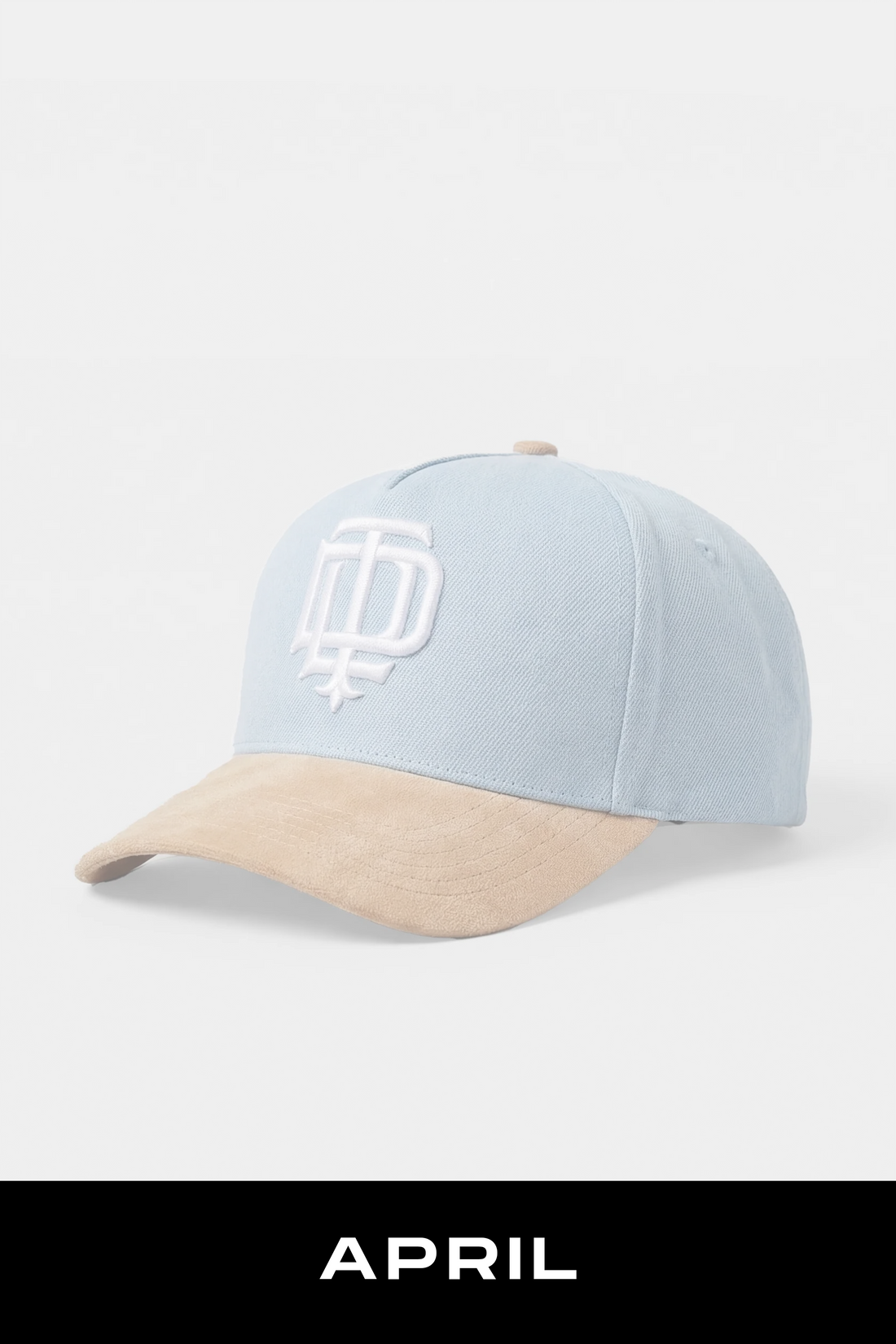 Light blue and beige cap with a logo on a white background, featuring the word 'APRIL'.